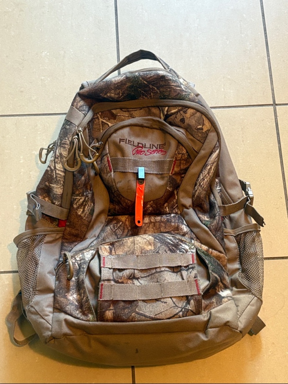 Fieldline ProSeries  Camo Backpack - Brown/Green with miscellaneous items